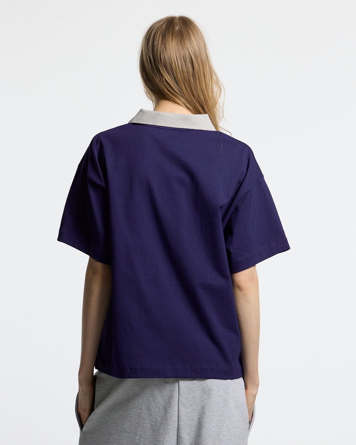 HEAT GYM POLO NAVY - navy zip polo shirt, back view on female model - Cold Culture