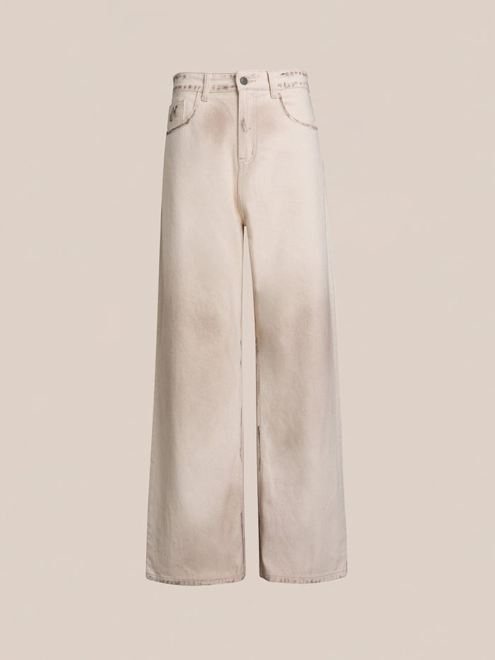 FOUND's Lacy Baggy Jeans feature a wide-leg, high-waisted design in a dirty white wash, complete with a button and zip fly, front pockets, and slight fading.