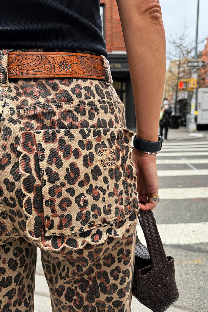 Leopard Lucia Scallop Detail Jeans featuring scalloped pockets and embroidered logo in a street setting.