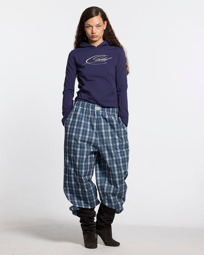 LIAR PANTS BLUE - blue plaid women's sweatpants, front view on female model - Cold Culture #woman