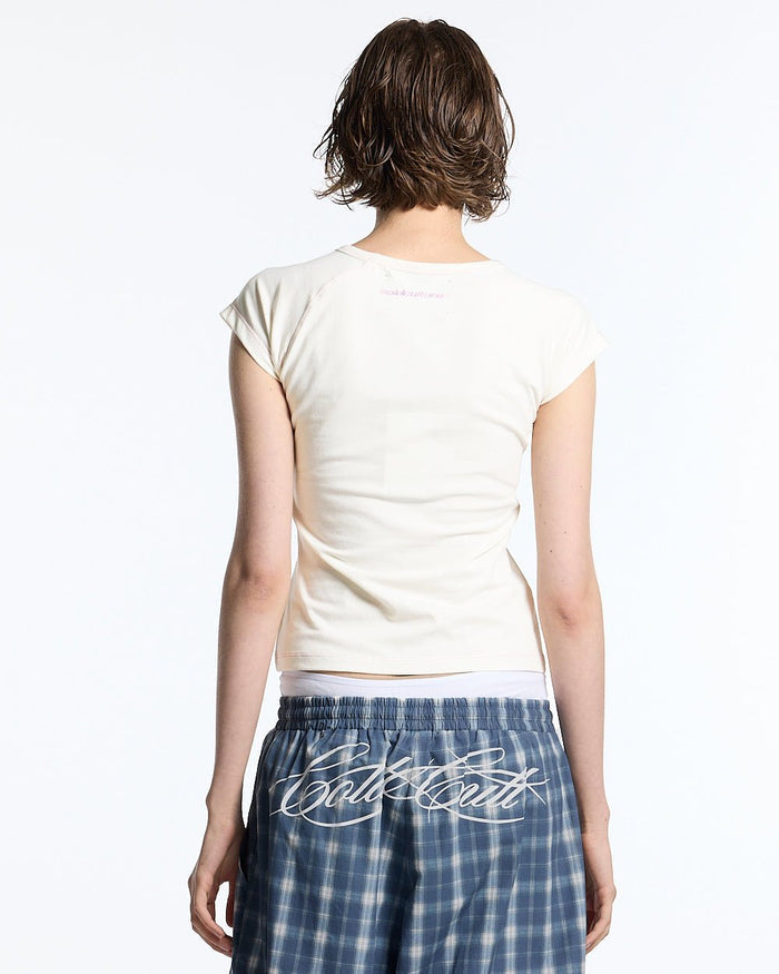 LITTLE BABY TEE WHITE - off-white graphic baby tee, back view on female model - Cold Culture