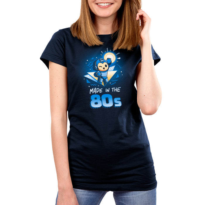 Premium Cotton T-shirt_TeeTurtle navy blue Made in the 80s featuring a winking Mega Man with his blaster arm in the air surrounded by 80s graphic elements, and the caption, "Made in the 80s".
