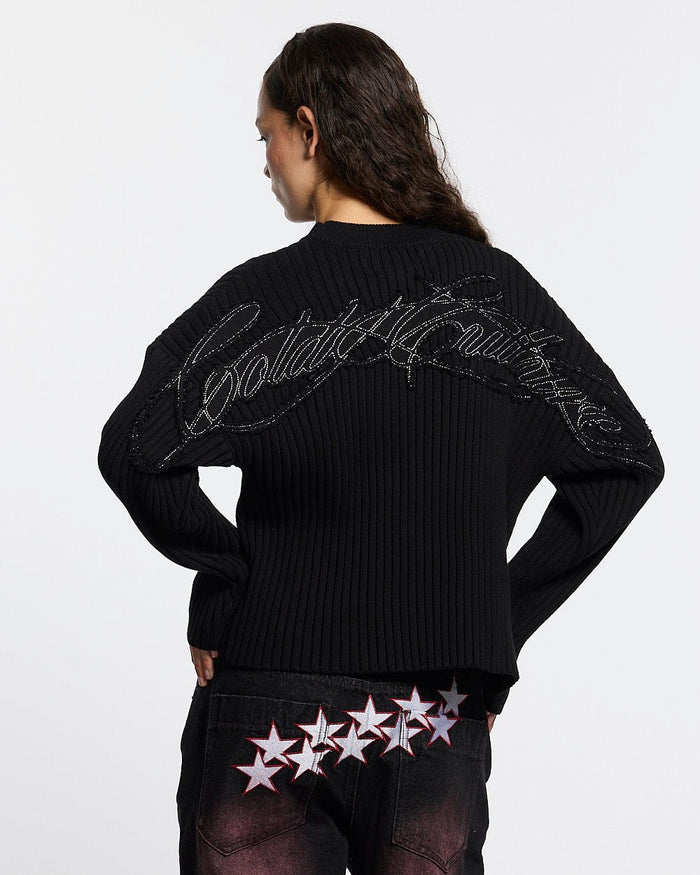 MESSY KNIT BLACK - black ribbed knit sweater, back view on female model - Cold Culture #woman