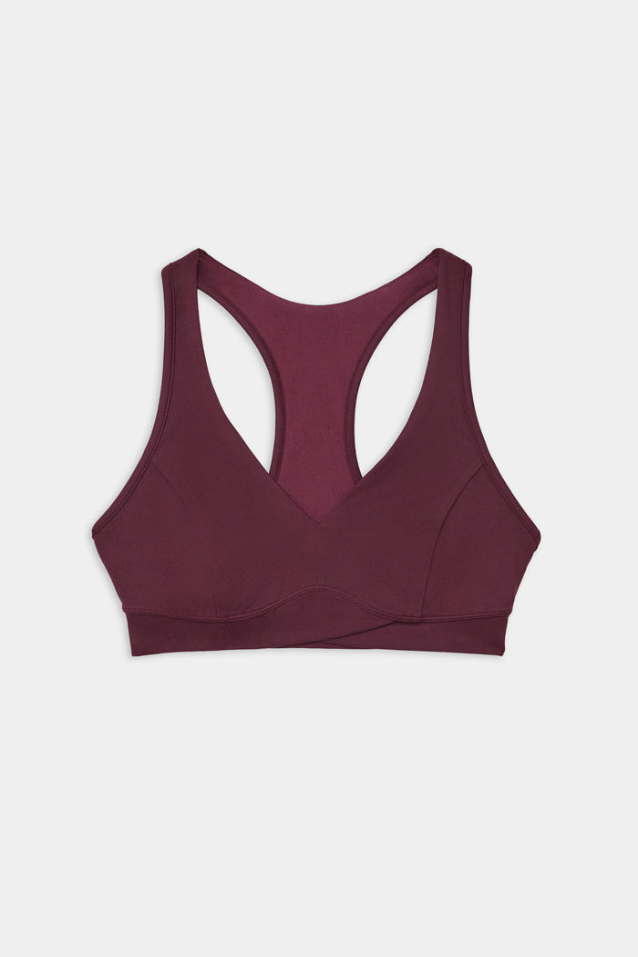 The SPLITS59 Mia Rigor Bra in Dark Cherry, a soft nylon-spandex racerback sports bra, is laid flat on a white background.