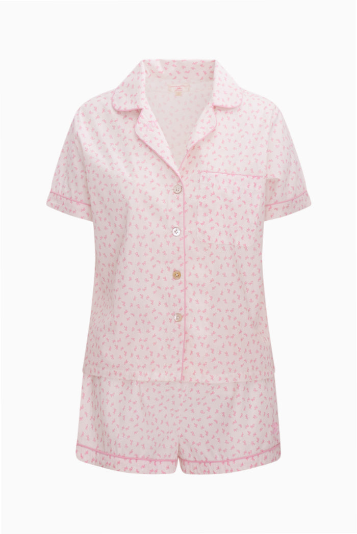 Pink patterned pajama set on a white background