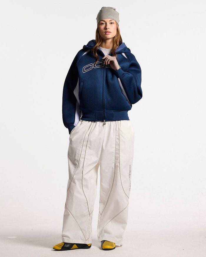 NEO ZIP JACKET WHITE & BLUE - navy and white zip jacket, front view on female model - Cold Culture #woman