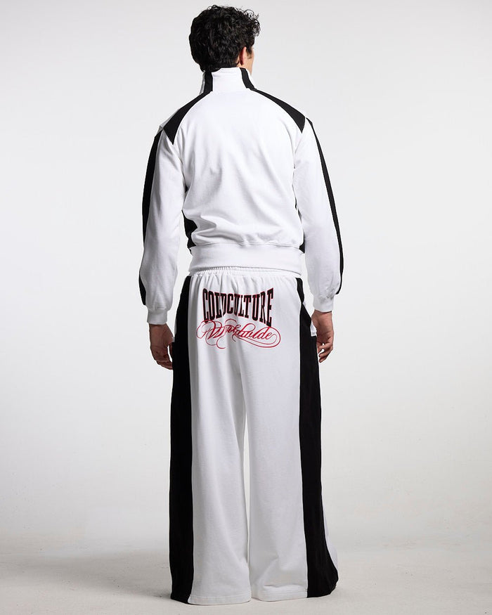 NIA SET SWEATPANTS WHITE & BLACK - white and black wide-leg sweatpants, back view on male model - Cold Culture #man