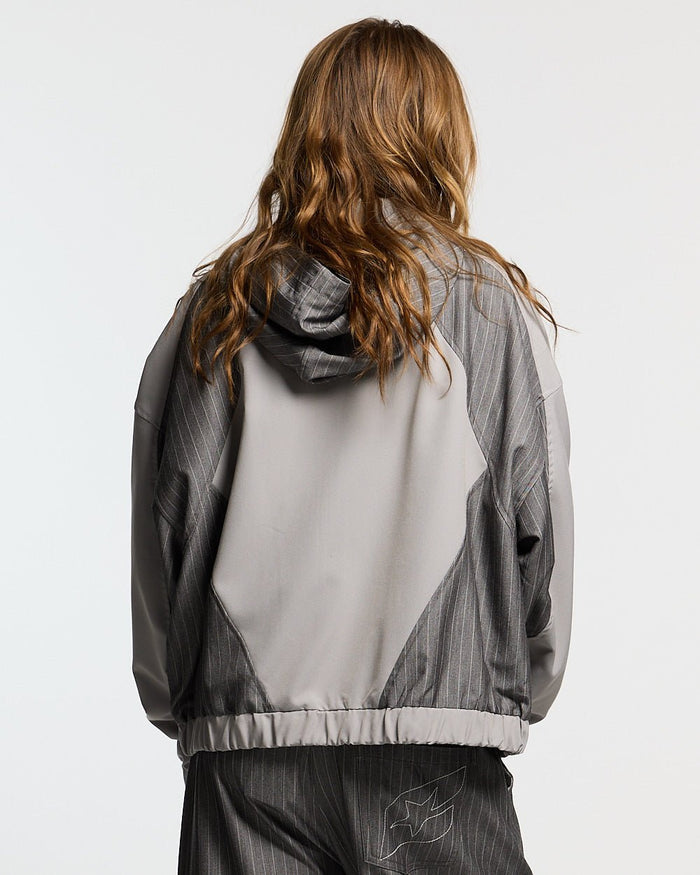 NOT FORMAL SET JACKET GREY - grey pinstripe track jacket, back view on female model - Cold Culture #woman