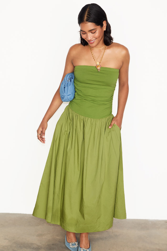 NFD Olive Lola Mid-axi Dress with a ruched jersey top and cotton skirt, styled with blue accessories.