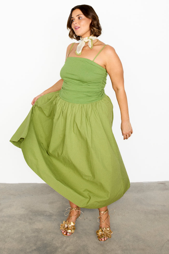Olive Lola Mid-axi Dress in green cotton with a ruched bodice and full skirt, shown on a curve model.