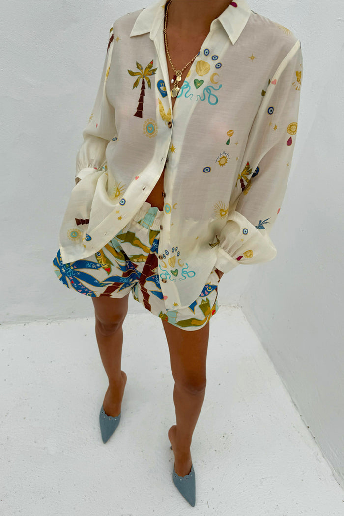 Palm Elissa Shorts in a cotton-linen blend with a multi-coloured palm leaf print, styled with a coordinating shirt.
