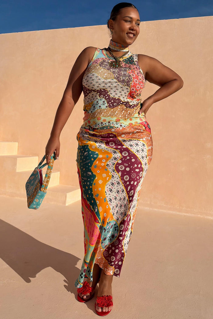 Pastel Morocco Dorris Skirt in a multi-colour abstract print with eye motifs, shown on a model for inclusive sizing.
