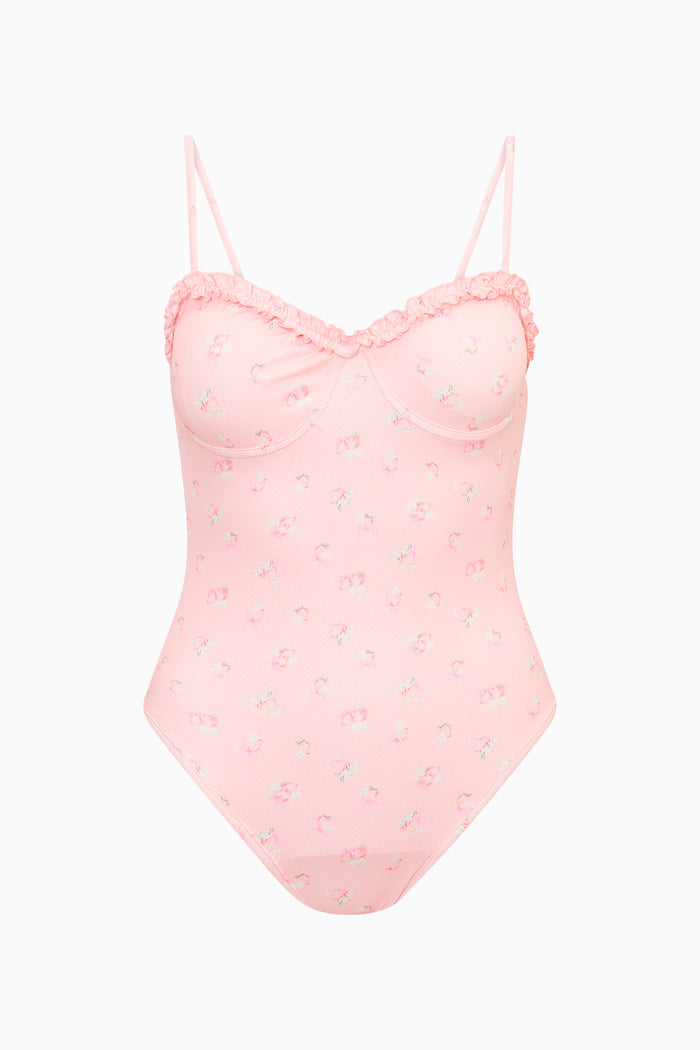Pink lace-trimmed one-piece swimsuit on a white background