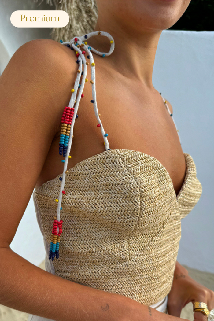 Premium beige Raffia Cecilia Top with corset structure and multicoloured beaded multi-wear straps.