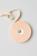 Pink satin Bloch Ribbon Seven Eights Inch flatlay roll of ribbon