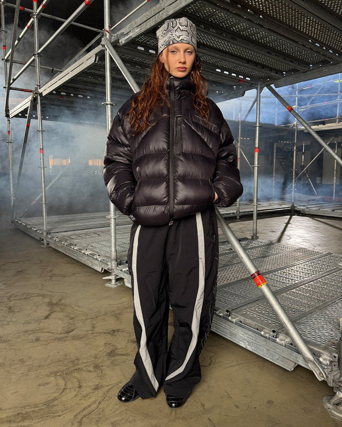 SCRIPT TECH PANTS BLACK - black script print sweatpants, street style shot - Cold Culture