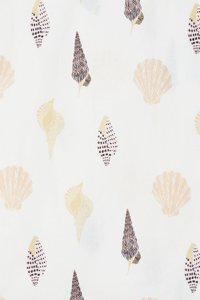 Shell print fabric for the Shells Jaspre Wrap Skirt featuring illustrated shells on a white cotton-linen base.