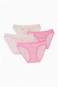 Set of pink and white women's underwear on a white background