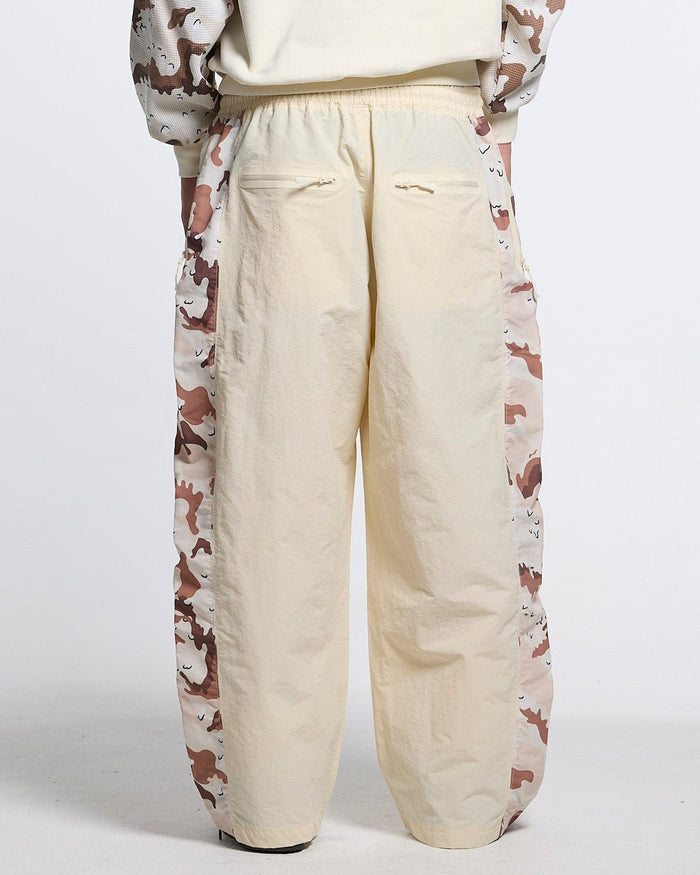 SPIDER PANTS BEIGE & CAMO - beige camo panel sweatpants, back view on male model - Cold Culture #man