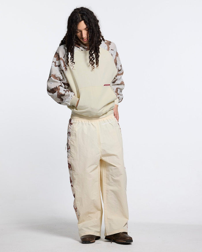 SPIDER PANTS BEIGE & CAMO - beige camo panel sweatpants, front view on male model - Cold Culture #man