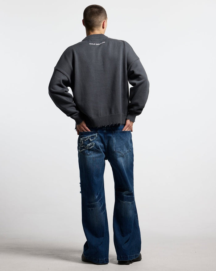 STARS KNIT INDIA INK - charcoal distressed knit sweater, back view on male model - Cold Culture #man