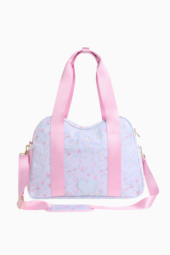 Light blue duffel bag with pink straps on a white background