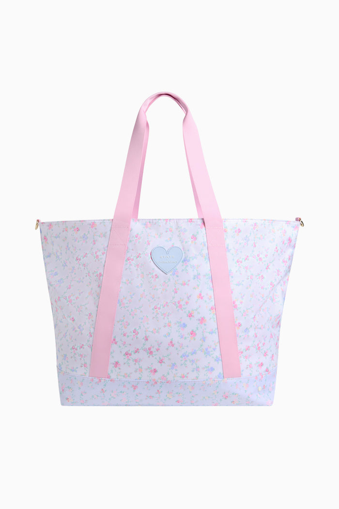 Tote bag with pink straps and a floral design on a white background
