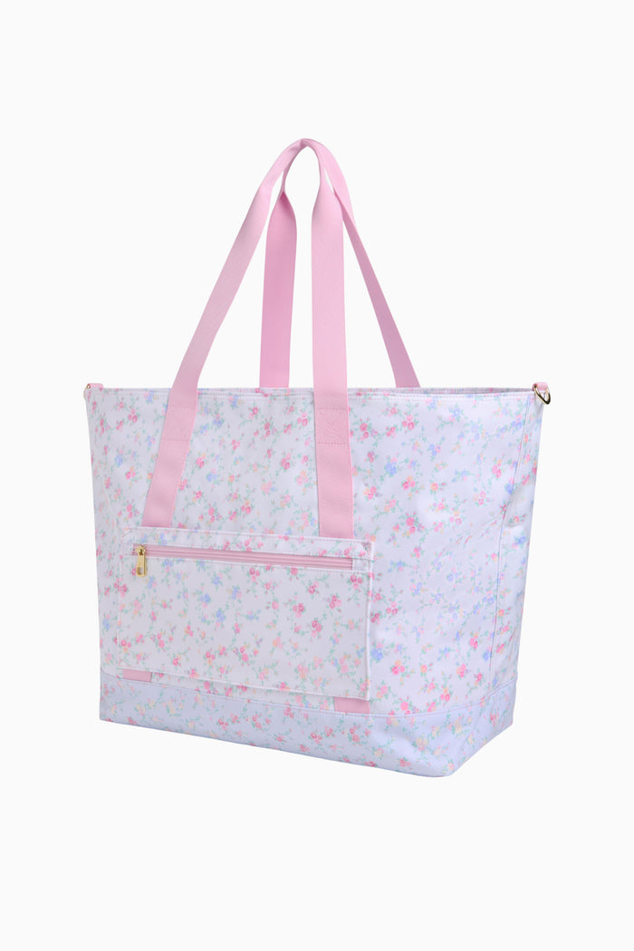 Tote bag with pink straps and floral pattern on a white background