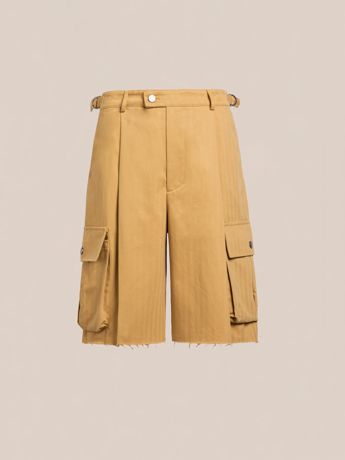 FOUND Sunlight Twill Cargo Shorts: unisex khaki herringbone twill with front pleats, side utility pockets with button flaps, belt loops, and a raw-edge hem, shown on a plain beige background.