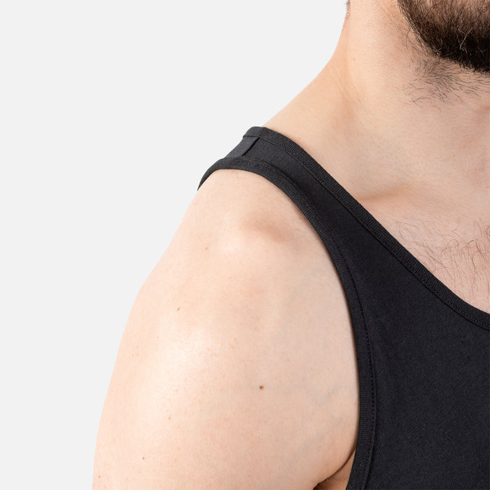 Close up of right shoulder of BRUNT comfortable work tank top in black