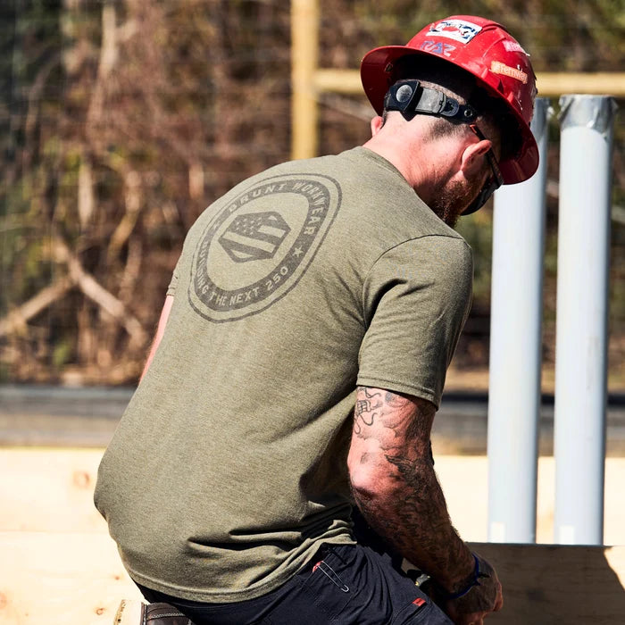 Man on jobsite wearing the limited edition BRUNT high quality t-shirt in military green frost