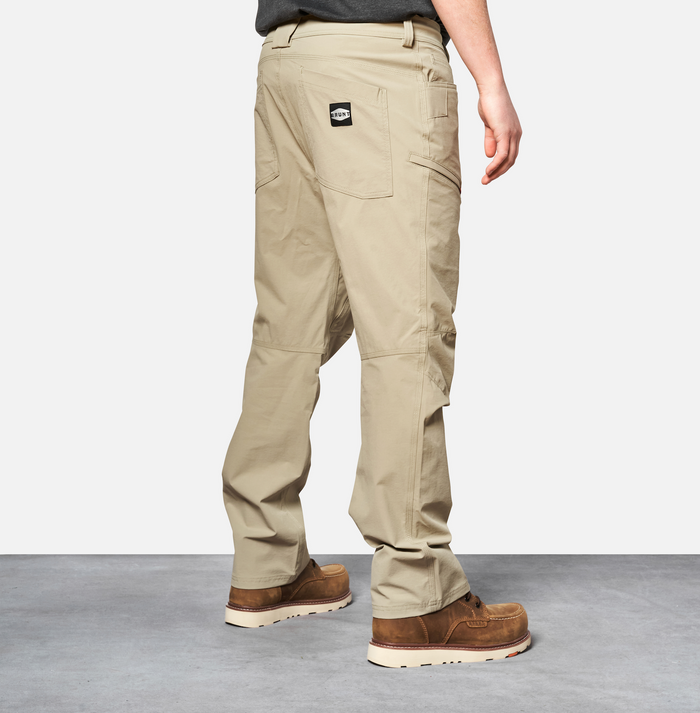 45 degree angle of back right side of BRUNT water-resistant lightweight breathable costello work pant in khaki * 0