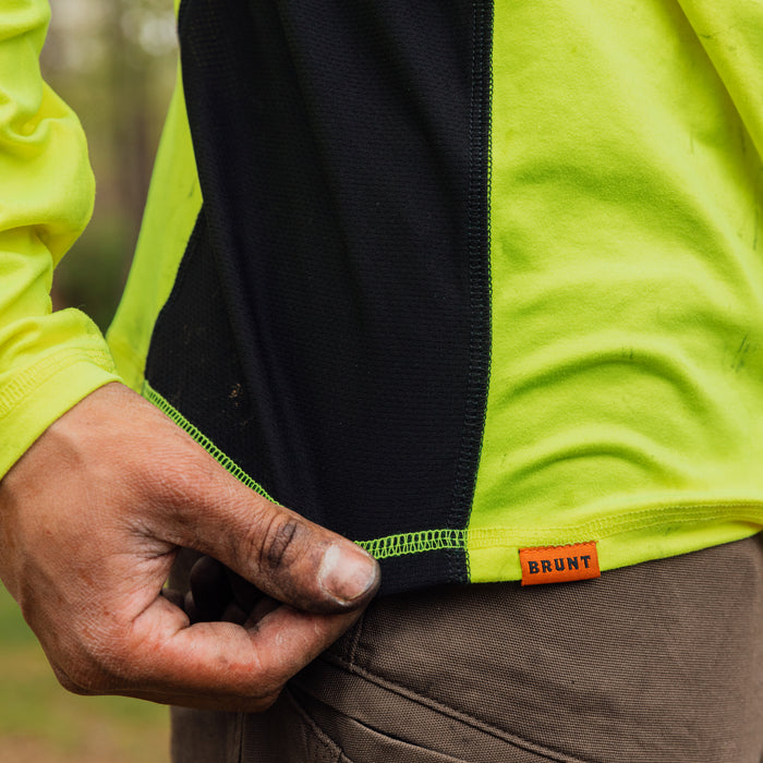 Stretching hemline of the BRUNT lightweight mckenna long sleeve sun tee with UPF protection in hi vis yellow * 0