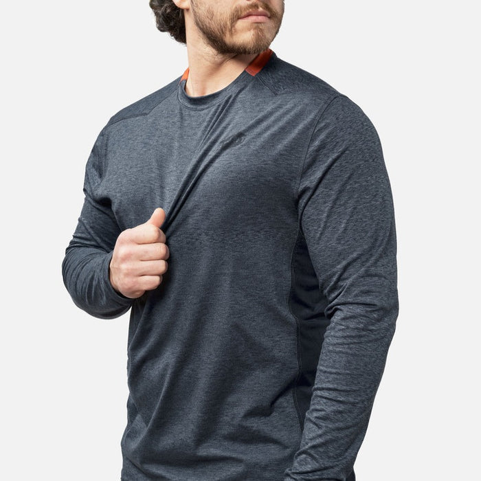 View 2 stretching chest of the BRUNT lightweight mckenna long sleeve sun tee with UPF protection in blue heather