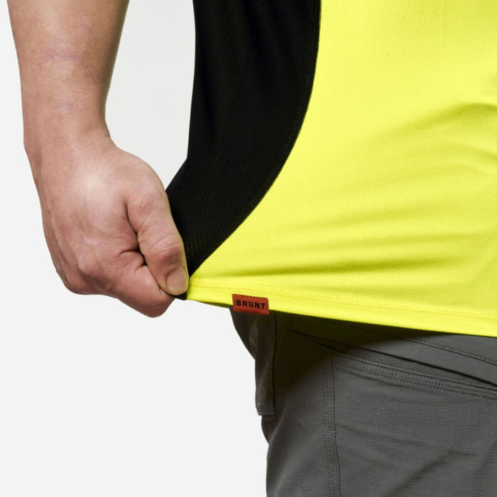 Stretching hemline of the BRUNT lightweight mckenna sun tee with UPF protection in safety yellow