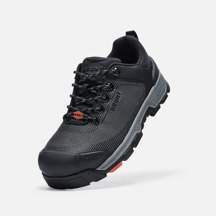 45 degree angle of the left BRUNT 4 inch low top 90 degree heel composite toe work shoe in black