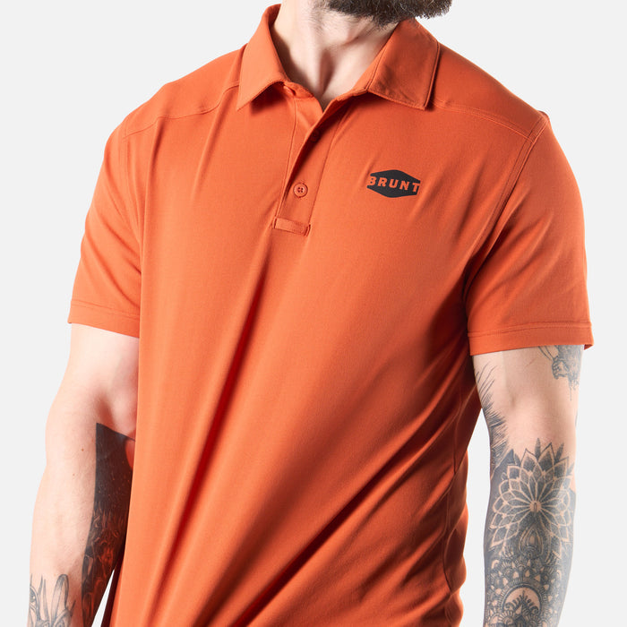View 2 stretching front of the BRUNT lightweight breathable polo with UPF protection in BRUNT orange * 4