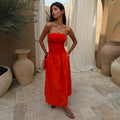 Tomato Lola Mid-axi Dress in red with a ruched bandeau bodice and cotton skirt, ideal for summer vacation dressing.