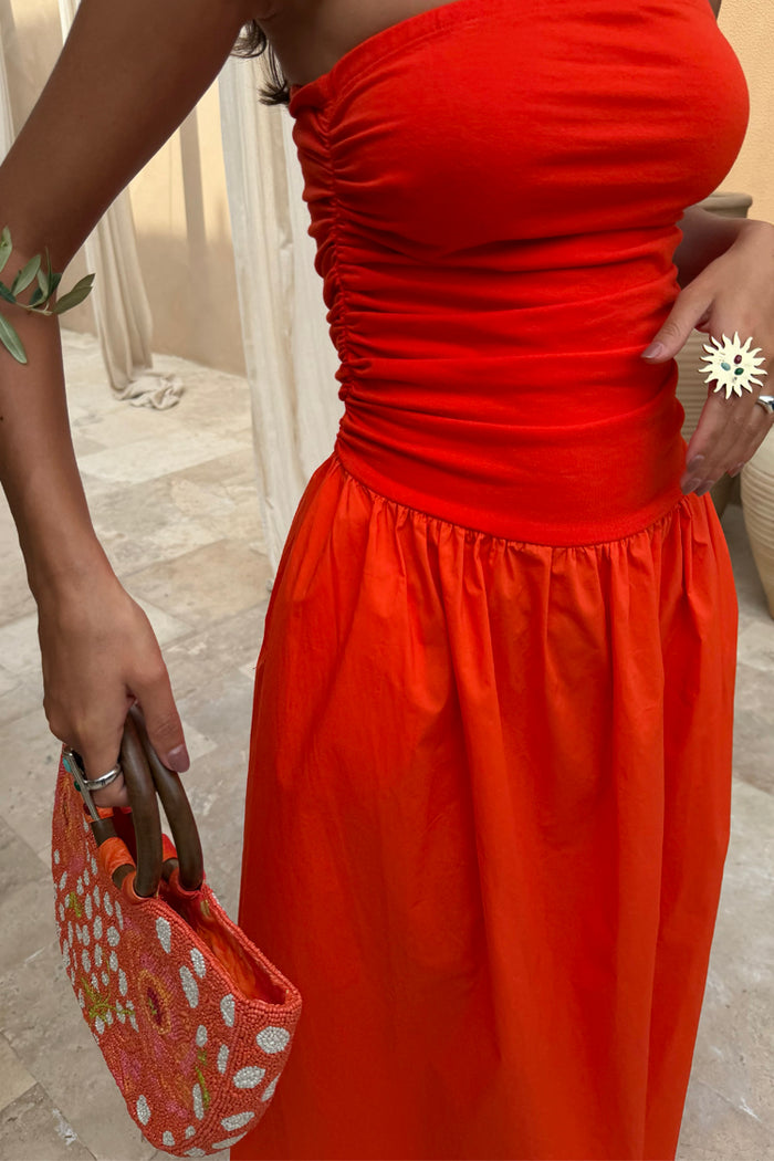 Tomato Lola Mid-axi Dress in red featuring ruched side seams and a breathable cotton skirt.