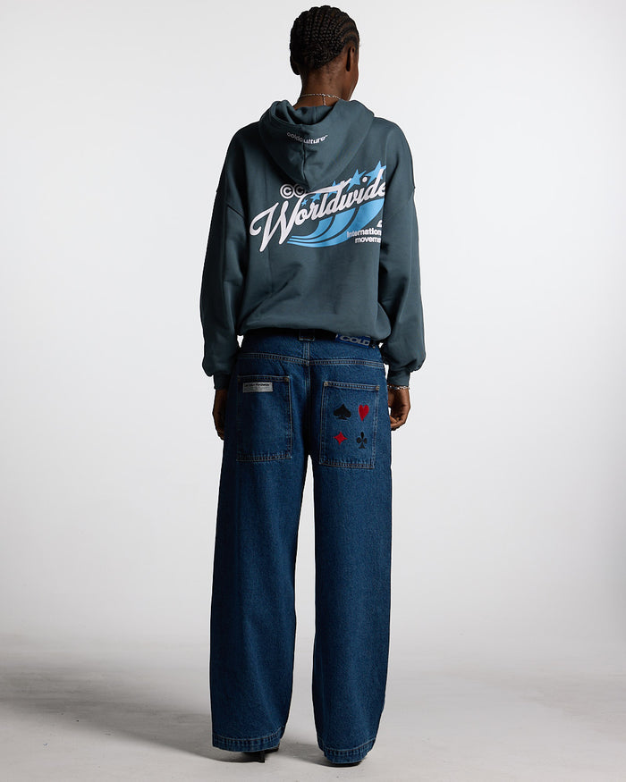 V2 PANTS BLUE DENIM - blue baggy denim pants, back view on female model - Cold Culture #woman