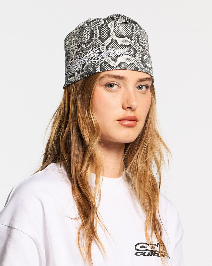 WILD SCRIPT BEANIE SNAKE - grey snake print beanie, on model close-up - Cold Culture #woman