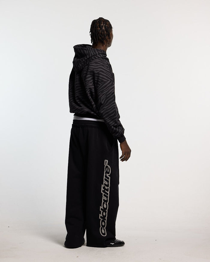 ZEBRA HOODIE BLACK - black zebra print hoodie, side view - Cold Culture #man