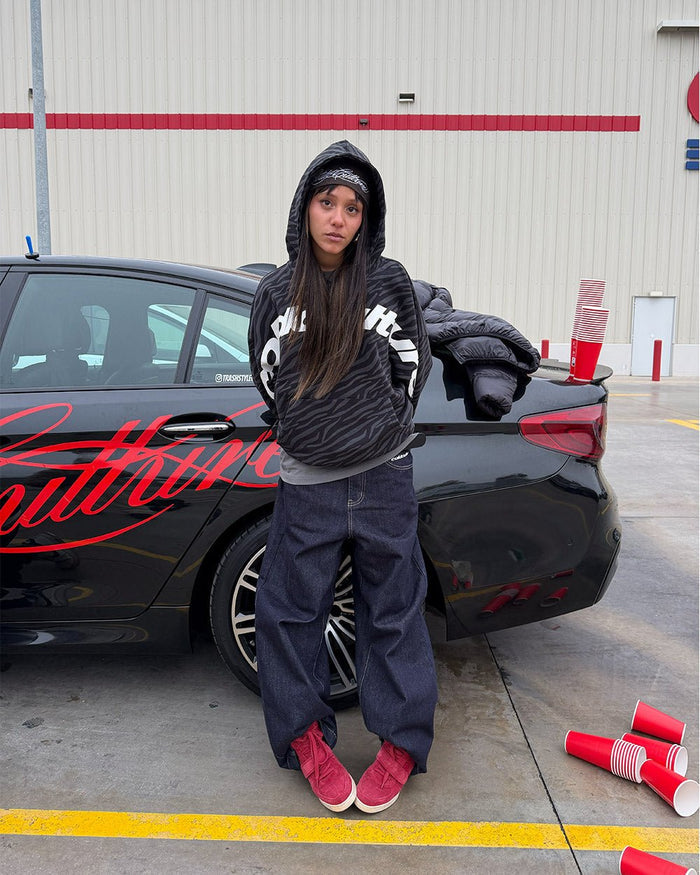 ZEBRA HOODIE BLACK - black zebra print hoodie, street style shot - Cold Culture